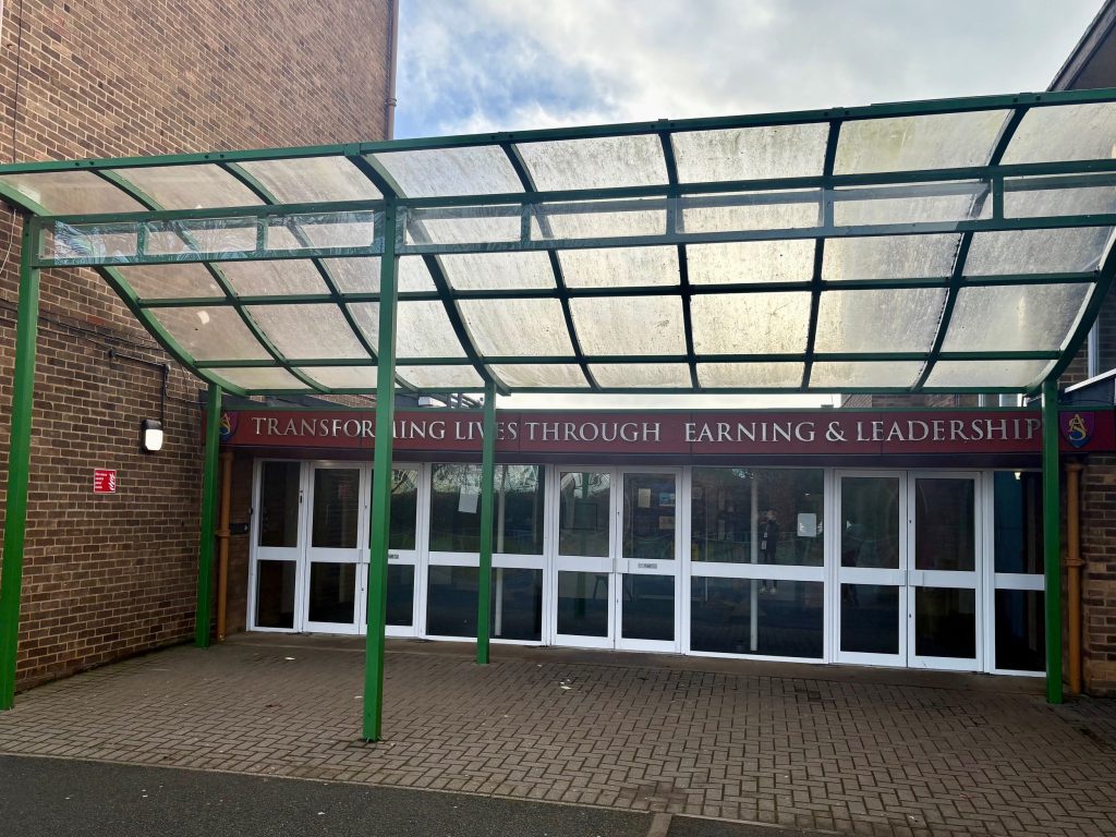Enter the school through these doors.